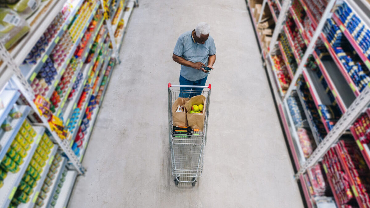 man shops at grocery store
